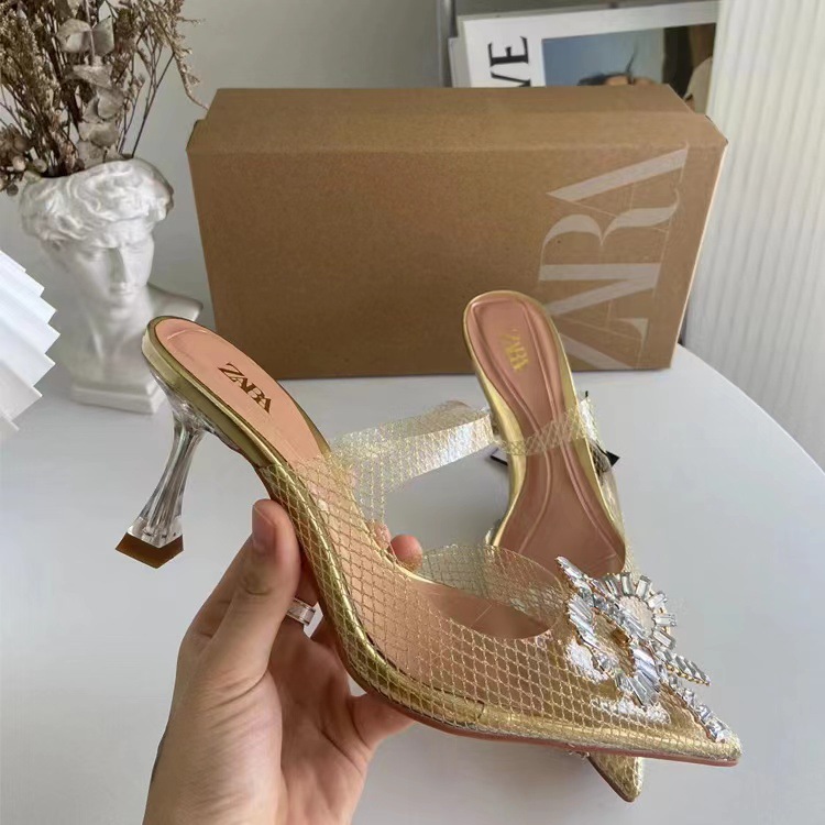 Gold vinyl heels with strap and jewel bow front